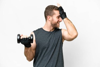 Young sport man making weightlifting over isolated white background has realized something and intending the solution