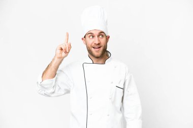 Young blonde man Chef over isolated white background intending to realizes the solution while lifting a finger up