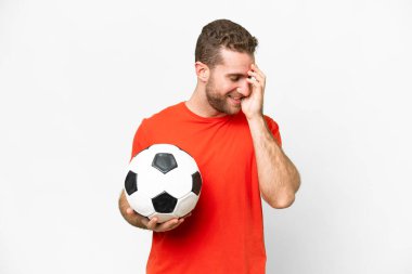 Handsome young football player man over isolated white background laughing