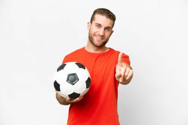 Handsome young football player man over isolated white background showing and lifting a finger
