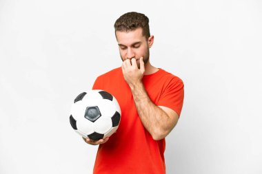 Handsome young football player man over isolated white background having doubts