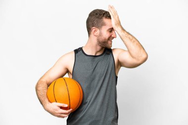 Handsome young man playing basketball over isolated white background has realized something and intending the solution