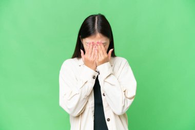 Young Asian woman over isolated chroma key background with tired and sick expression