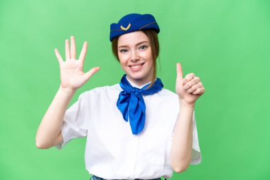 Airplane stewardess over isolated chroma key background counting six with fingers