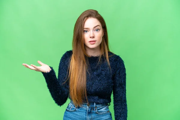 Young Pretty Woman Isolated Chroma Key Background Making Doubts Gesture — Stockfoto