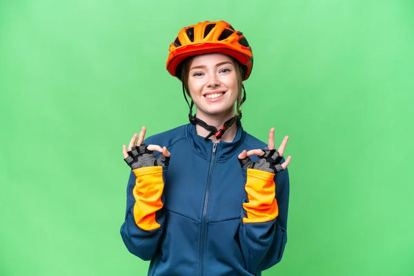 Young Cyclist Woman Isolated Chroma Key Background Showing Sign Fingers — Stockfoto