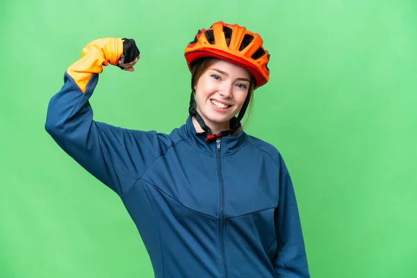 Young Cyclist Woman Isolated Chroma Key Background Doing Strong Gesture — Stockfoto