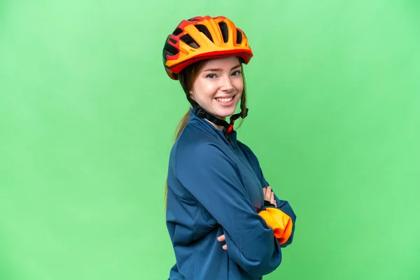 Young Cyclist Woman Isolated Chroma Key Background Arms Crossed Looking — Stockfoto