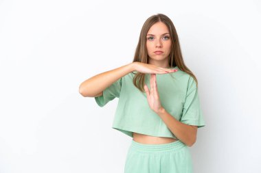 Young Lithuanian woman isolated on white background making time out gesture