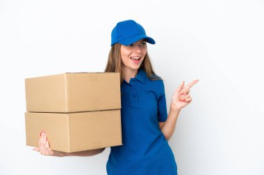 Delivery Lithuanian woman isolated on white background pointing finger to the side and presenting a product