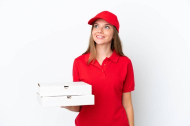 Pizza delivery Lithuanian woman isolated on white background thinking an idea while looking up