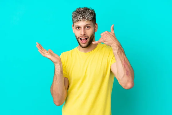 Young Handsome Caucasian Man Isolated Blue Background Making Phone Gesture — Stock fotografie