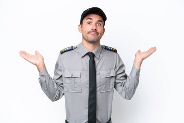 Young safeguard man over isolated white background having doubts while raising hands