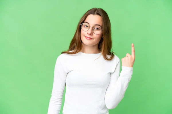 Teenager Girl Isolated Chroma Key Background Showing Lifting Finger Sign — Stockfoto