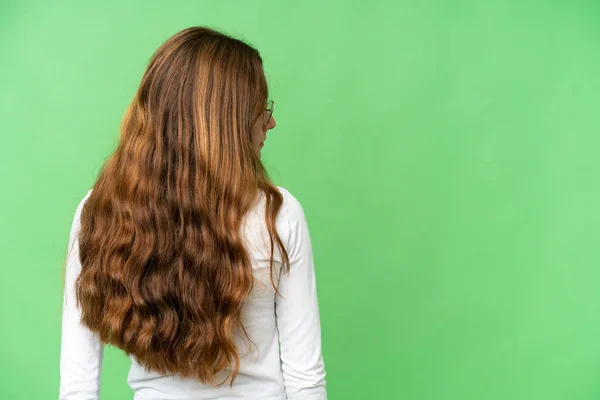 Teenager Girl Isolated Chroma Key Background Back Position Looking Side — Stock fotografie