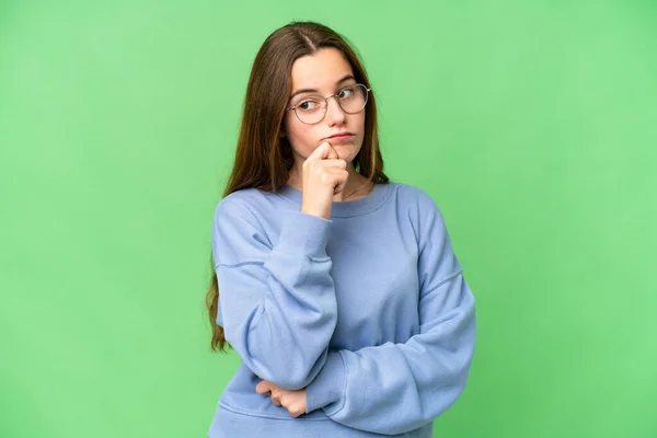Teenager Girl Isolated Chroma Key Background Having Doubts Thinking — Stockfoto