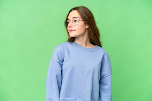 Teenager Girl Isolated Chroma Key Background Looking Side Smiling — Fotografia de Stock