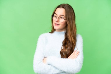 Teenager girl over isolated chroma key background happy and smiling