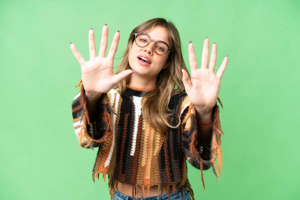 Young girl over isolated chroma key background counting ten with fingers