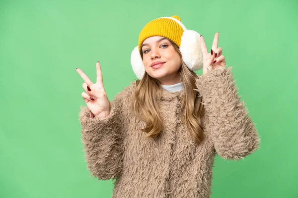 Young Girl Wearing Winter Muffs Isolated Chroma Key Background Showing — Stock Photo, Image
