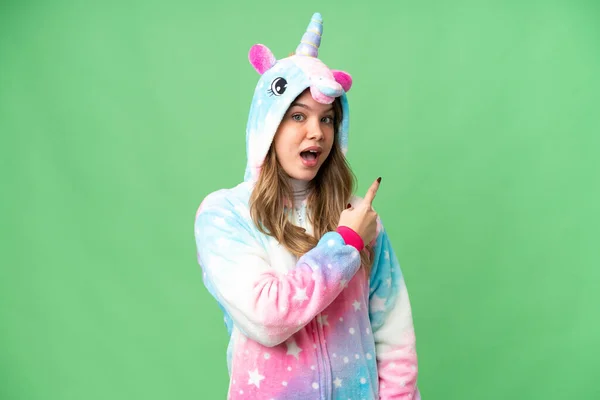 Young Girl Unicorn Pajamas Isolated Chroma Key Background Surprised Pointing — Stock Photo, Image