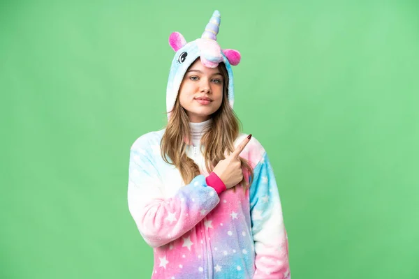 Young Girl Unicorn Pajamas Isolated Chroma Key Background Pointing Side — Stock Photo, Image