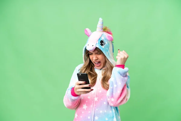 Young Girl Unicorn Pajamas Isolated Chroma Key Background Phone Victory — Stock Photo, Image