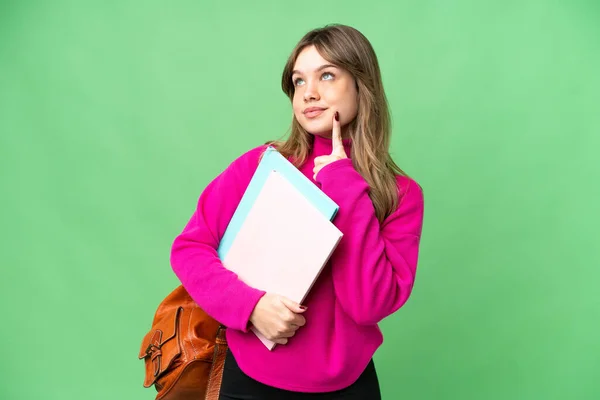 Joven Estudiante Sobre Aislado Croma Clave Fondo Pensando Una Idea — Foto de Stock