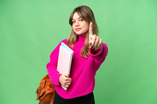 Young Student Girl Isolated Chroma Key Background Showing Lifting Finger — Stock Photo, Image