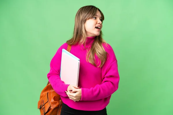 Young Student Girl Isolated Chroma Key Background Laughing Lateral Position — Stock Photo, Image