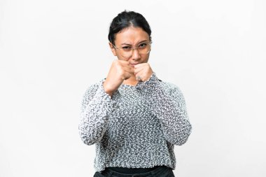 Young Uruguayan woman over isolated white background with fighting gesture