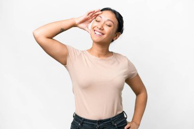 Young Uruguayan woman over isolated white background smiling a lot