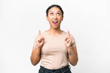 Young Uruguayan woman over isolated white background surprised and pointing up