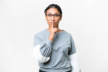 Young Uruguayan woman over isolated white background showing a sign of silence gesture putting finger in mouth