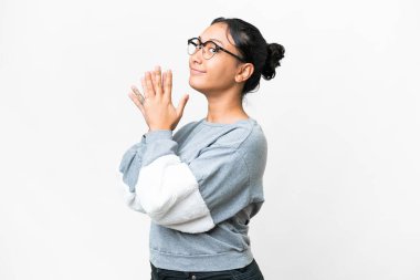 Young Uruguayan woman over isolated white background scheming something