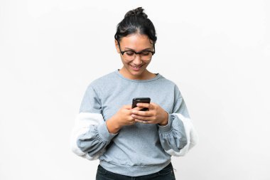 Young Uruguayan woman over isolated white background sending a message with the mobile