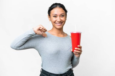 Young Uruguayan woman holding soda over isolated white background proud and self-satisfied