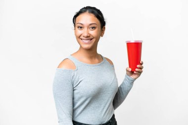 Young Uruguayan woman holding soda over isolated white background smiling a lot