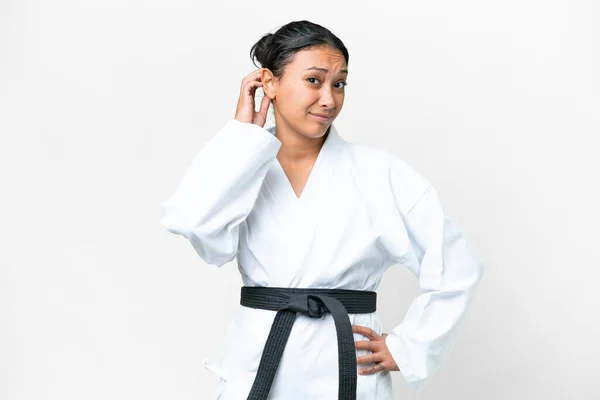 Young Uruguayan Woman Doing Karate Isolated White Background Having Doubts — 图库照片