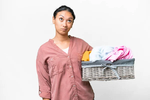 Young Uruguayan Woman Holding Clothes Basket Isolated White Background Looking — Stock Photo, Image