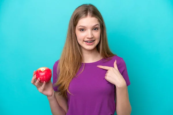 Teenager Girl Holding Apple Isolated Blue Background — Stock Photo, Image
