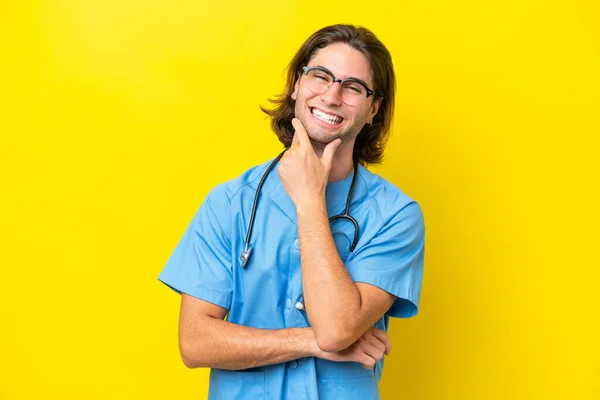 Young Surgeon Caucasian Man Isolated Yellow Background Smiling — Stock Photo, Image