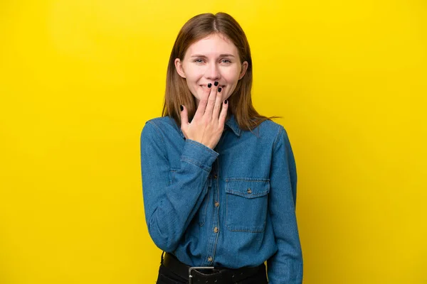 stock image Young English woman isolated on yellow background covering mouth with hand