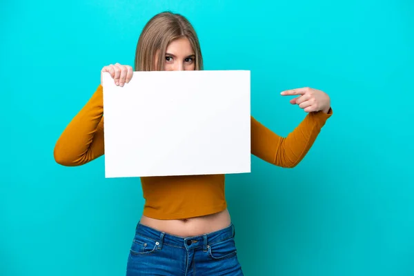 Young Caucasian Woman Isolated Blue Background Holding Empty Placard Hiding — Stock fotografie