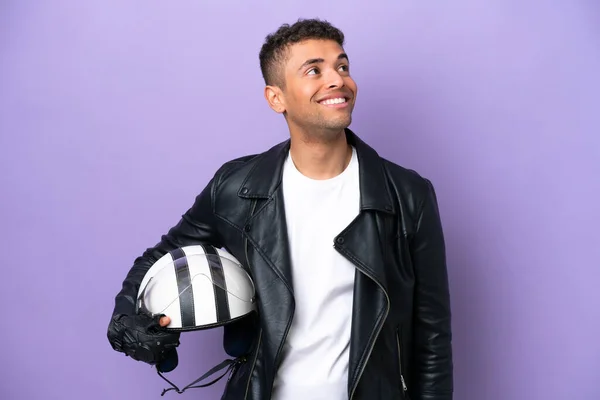 Young Brazilian Man Motorcycle Helmet Isolated Purple Background Thinking Idea — Stok fotoğraf