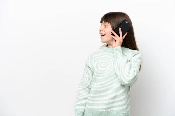 stock image Little caucasian girl isolated on white background keeping a conversation with the mobile phone with someone