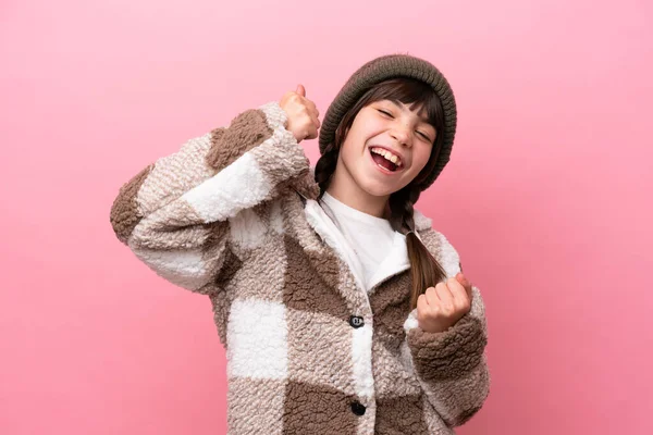 Little Caucasian Girl Winter Jacket Isolated Pink Background Celebrating Victory — Stockfoto