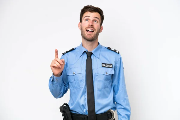 Young Police Caucasian Man Isolated White Background Pointing Surprised — Stok fotoğraf