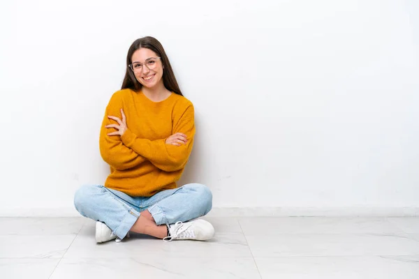 Young Girl Sitting Floor Isolated White Background Keeping Arms Crossed — Stock Photo, Image