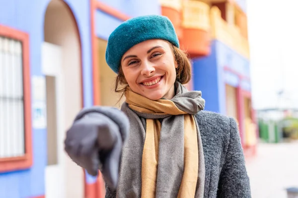 stock image Brunette woman at outdoors points finger at you with a confident expression